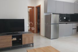 Stan u prizemlju s dvorištem i pogledom na more, Labin, Appartement